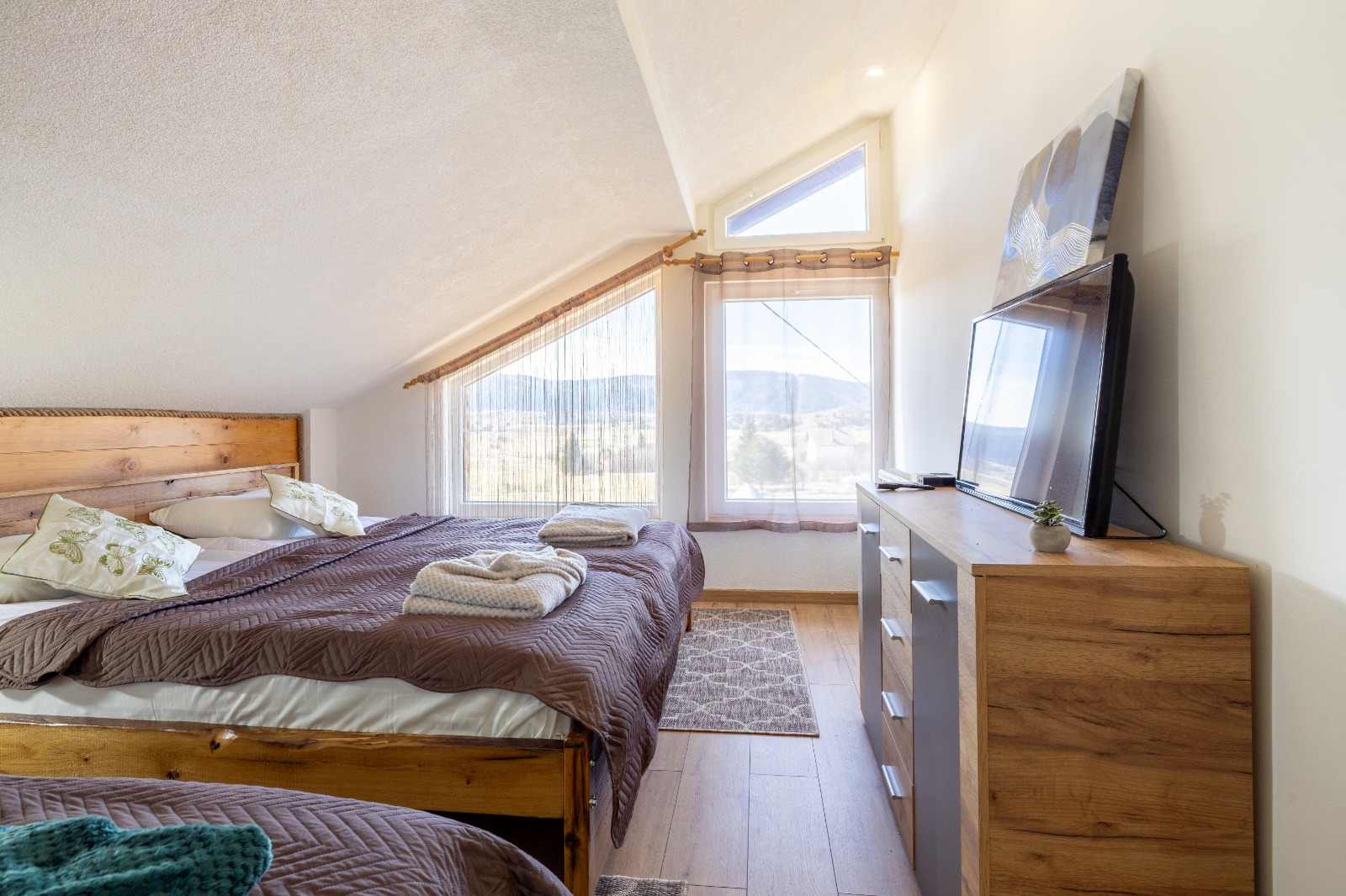 Bedroom with a solid oak bed in the attic